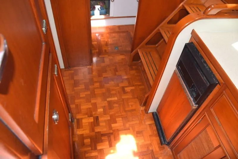 Jamie Lyn Yacht Photos Pics Interior of 1997 Grand Banks Classic yacht with wooden flooring and cabinetry.