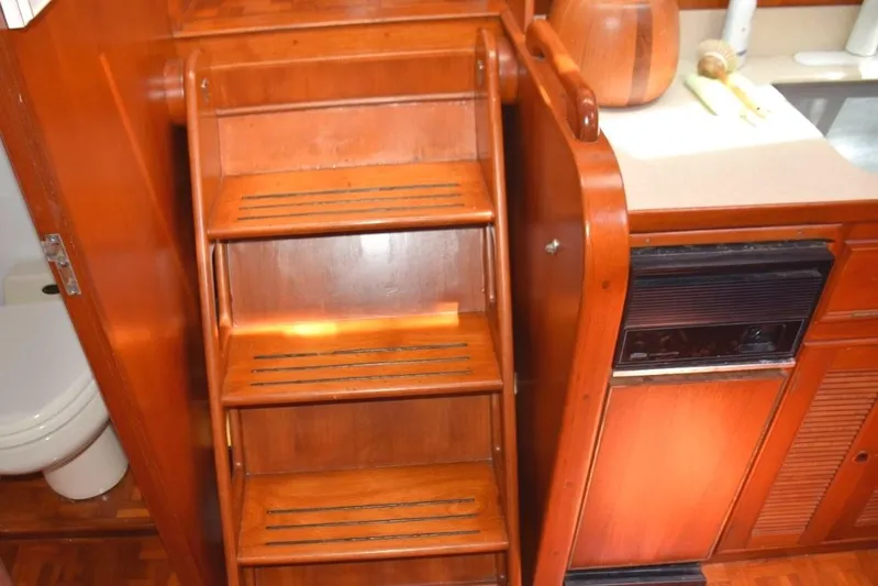 Jamie Lyn Yacht Photos Pics Wooden interior stairs and cabinetry in a 1997 Grand Banks Classic yacht.