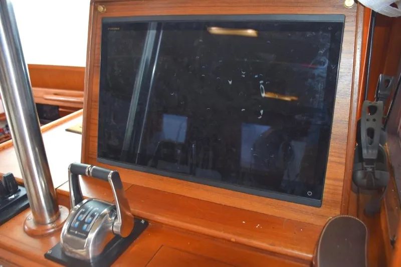 Jamie Lyn Yacht Photos Pics 1997 Grand Banks Classic yacht dashboard with navigation screen and control lever.