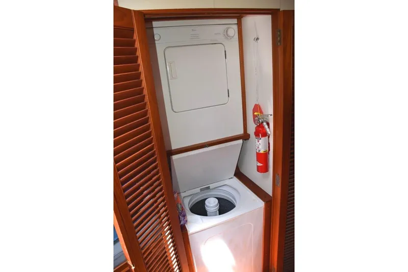 Jamie Lyn Yacht Photos Pics Laundry area with washer and dryer on 1997 Grand Banks Classic boat.
