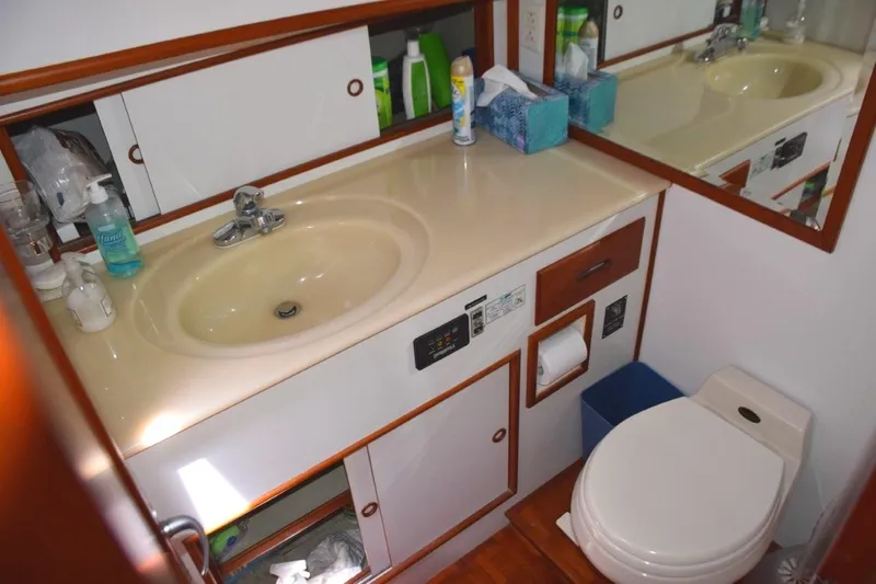 Jamie Lyn Yacht Photos Pics Bathroom interior of 1997 Grand Banks Classic yacht with sink and toilet.
