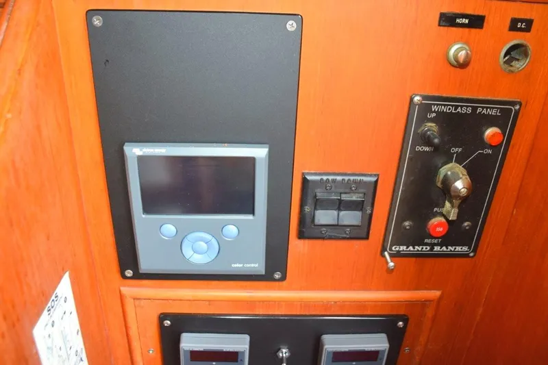 Jamie Lyn Yacht Photos Pics Control panel of a 1997 Grand Banks Classic boat with windlass and display.