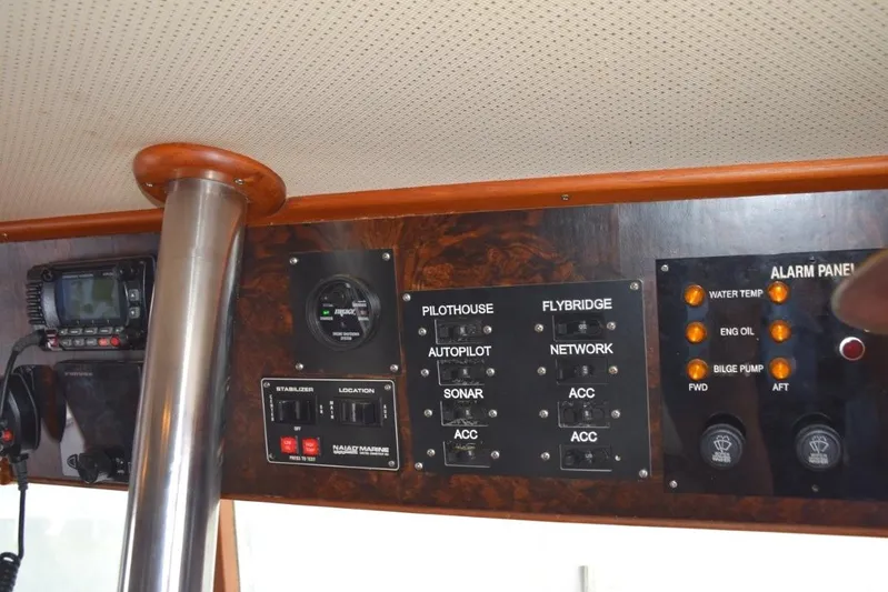 Jamie Lyn Yacht Photos Pics Control panel of a 1997 Grand Banks Classic boat with various switches and indicators.