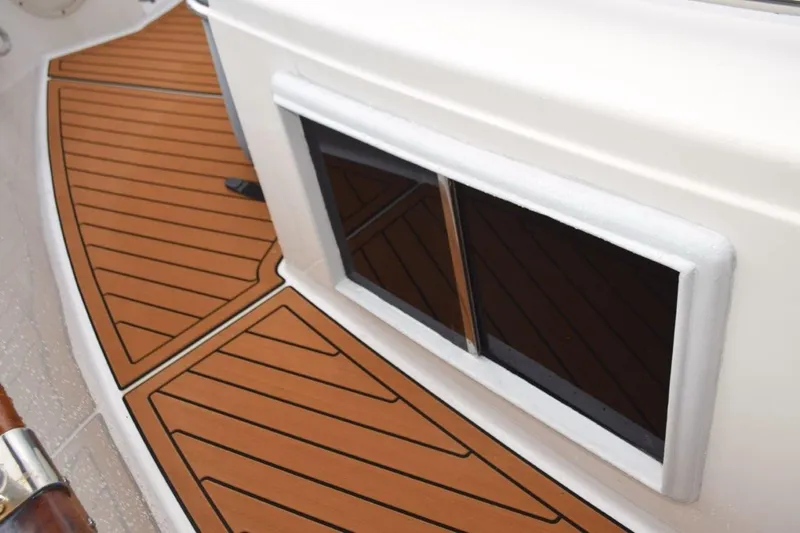 Jamie Lyn Yacht Photos Pics 1997 Grand Banks Classic boat deck with teak flooring and window detail.