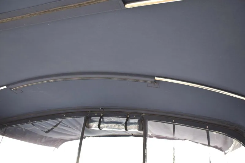 Jamie Lyn Yacht Photos Pics Interior view of 1997 Grand Banks Classic boat canopy with metal support bars.