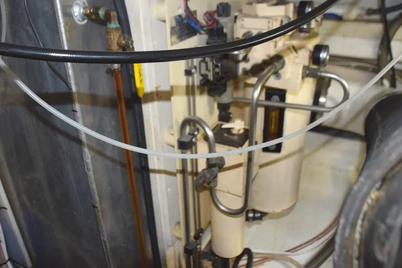 Jamie Lyn Yacht Photos Pics Engine room of a 1997 Grand Banks Classic boat, showcasing mechanical components and wiring.