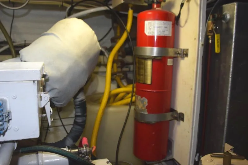 Jamie Lyn Yacht Photos Pics Engine room of 1997 Grand Banks Classic with fire extinguisher and equipment.
