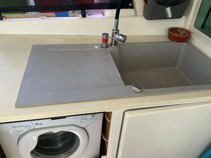  Yacht Photos Pics Kitchen sink and washing machine in 2007 Lagoon 440 catamaran interior.
