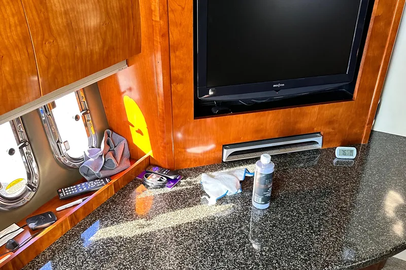 Majestic Yacht Photos Pics 2006 Cruisers Yachts 420 Express interior with TV, granite countertop, and porthole windows.