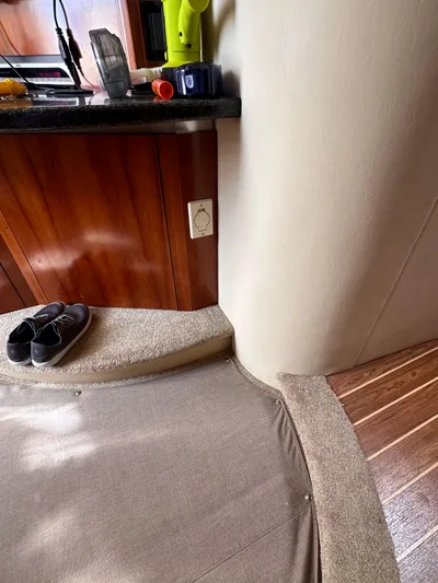 Majestic Yacht Photos Pics Interior of 2006 Cruisers Yachts 420 Express with carpeted steps and wooden cabinetry.