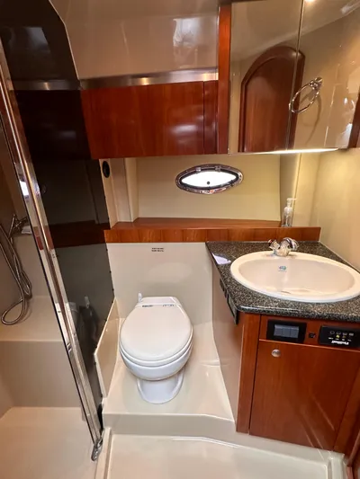 Majestic Yacht Photos Pics 2006 Cruisers Yachts 420 Express bathroom with shower, sink, and toilet.