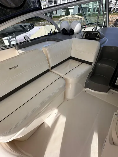 Majestic Yacht Photos Pics 2006 Cruisers Yachts 420 Express interior with white seating and helm.