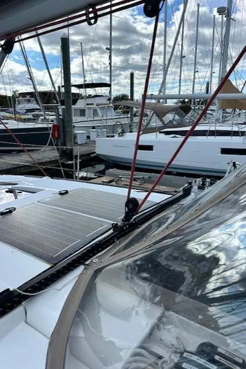 Patience Yacht Photos Pics 2012 Jeanneau Sun Odyssey 379 sailboat docked at marina with solar panels.