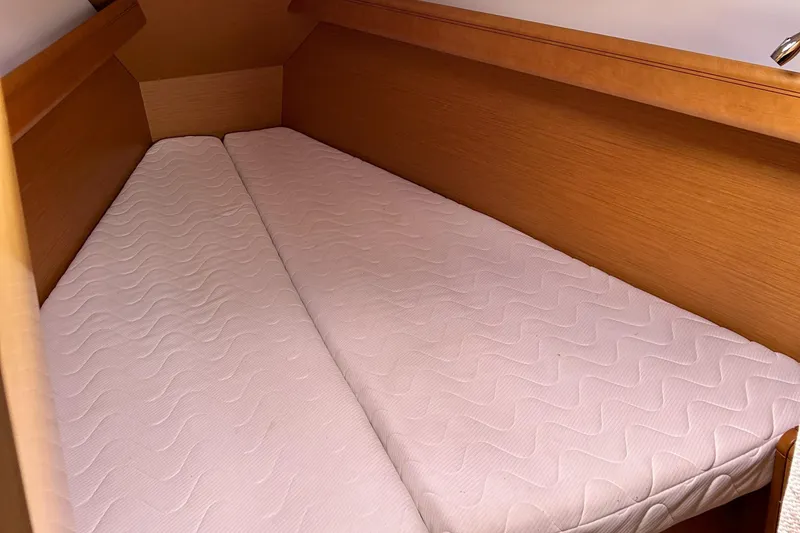 Patience Yacht Photos Pics Cabin interior of 2012 Jeanneau Sun Odyssey 379 with twin mattresses.