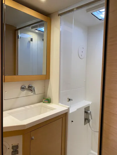 Blue Osprey Yacht Photos Pics Modern bathroom in 2020 Lagoon 450S yacht with sleek fixtures and natural lighting.