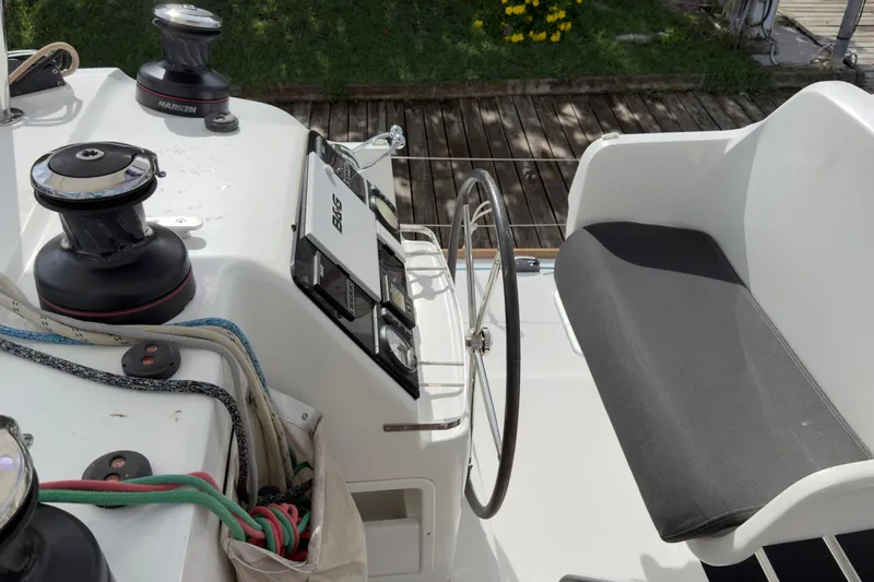 Blue Osprey Yacht Photos Pics Helm station of 2020 Lagoon 450S catamaran with steering wheel and navigation equipment.