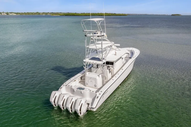  Yacht Photos Pics 2018 Yellowfin 42 Offshore boat with four engines on calm water.