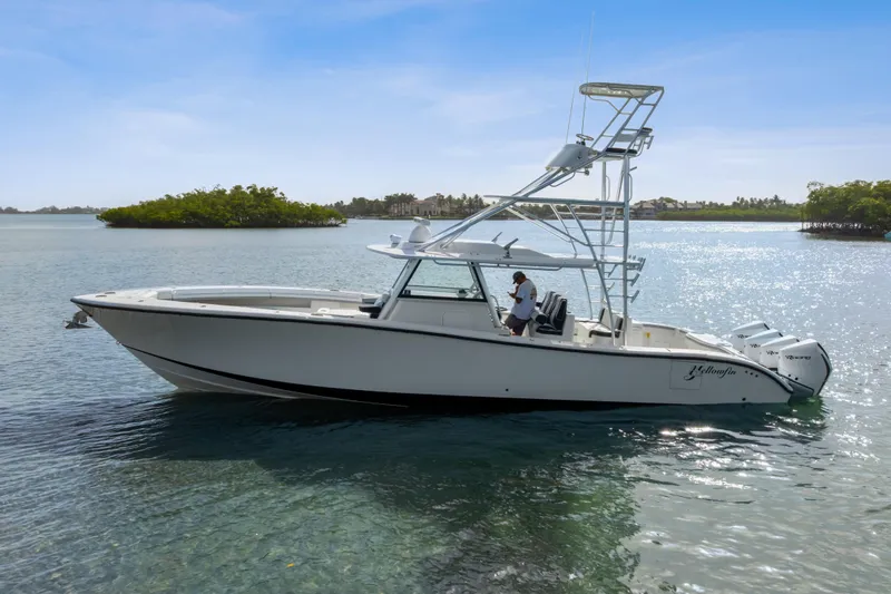  Yacht Photos Pics 2018 Yellowfin 42 Offshore boat on calm water, clear sky background.