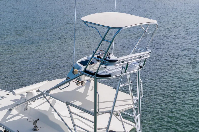  Yacht Photos Pics 2018 Yellowfin 42 Offshore boat tower over calm water.
