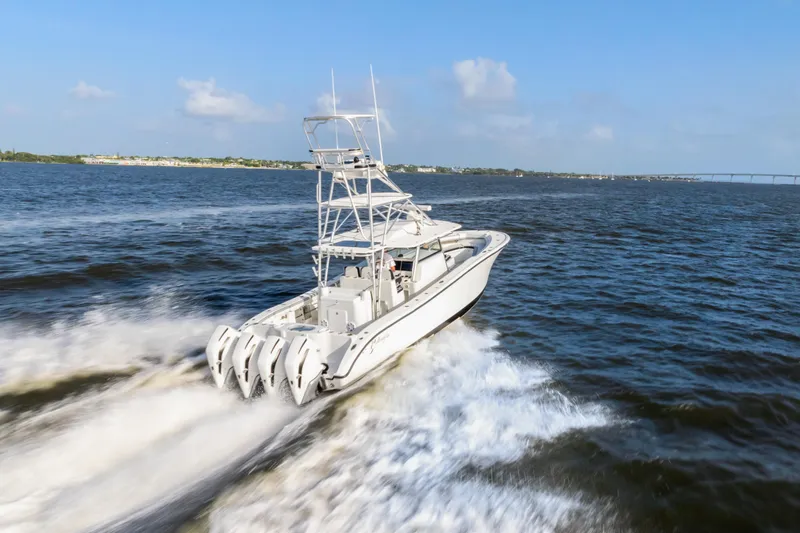  Yacht Photos Pics 2018 Yellowfin 42 Offshore boat cruising on open water, showcasing powerful engines.
