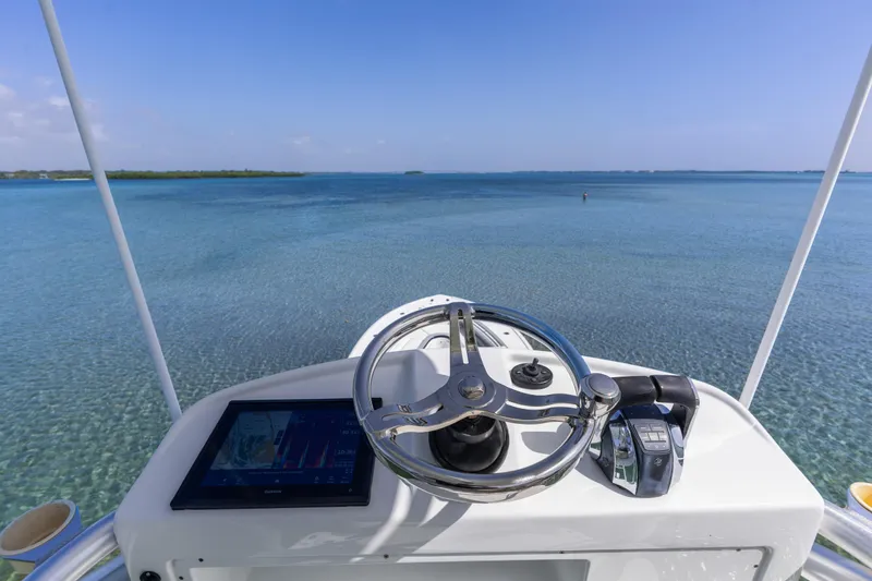  Yacht Photos Pics Helm view of 2018 Yellowfin 42 Offshore boat on clear blue water.