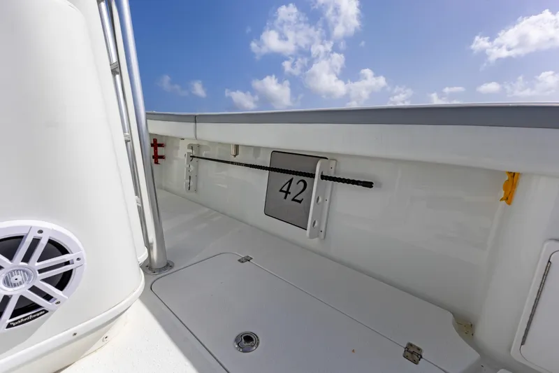  Yacht Photos Pics 2018 Yellowfin 42 Offshore boat interior with speaker and number 42 displayed.