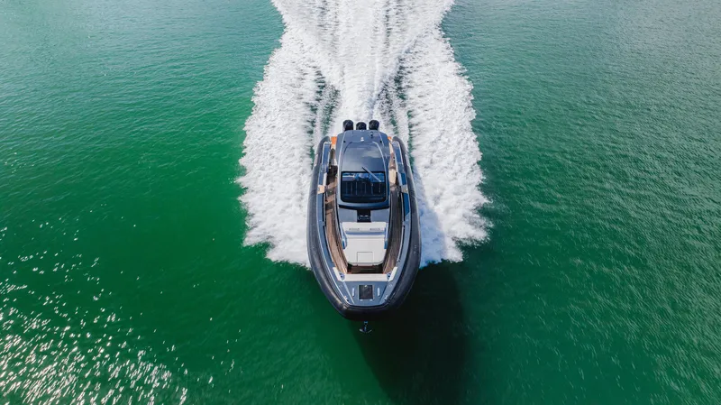 Heavy D Yacht Photos Pics 2023 Pirelli Tecnorib 50 cruising on open water, aerial view.