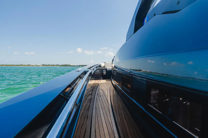 Heavy D Yacht Photos Pics 2023 Pirelli Tecnorib 50 yacht on open water, showcasing sleek design and wooden deck.