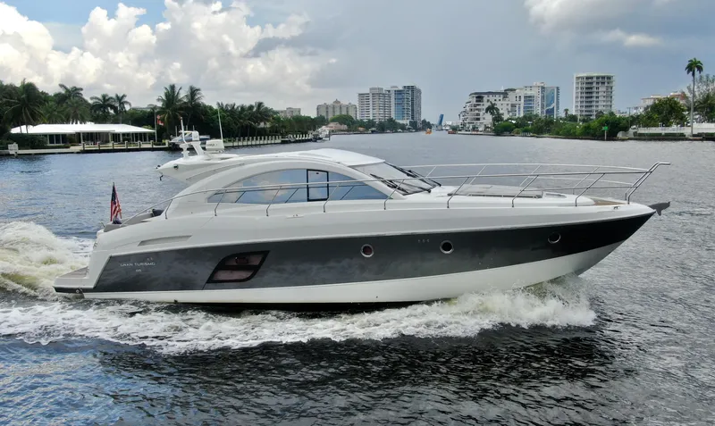 Oasis Yacht Photos Pics 2014 Beneteau GRAN TURISMO 49 yacht cruising on a scenic waterway.