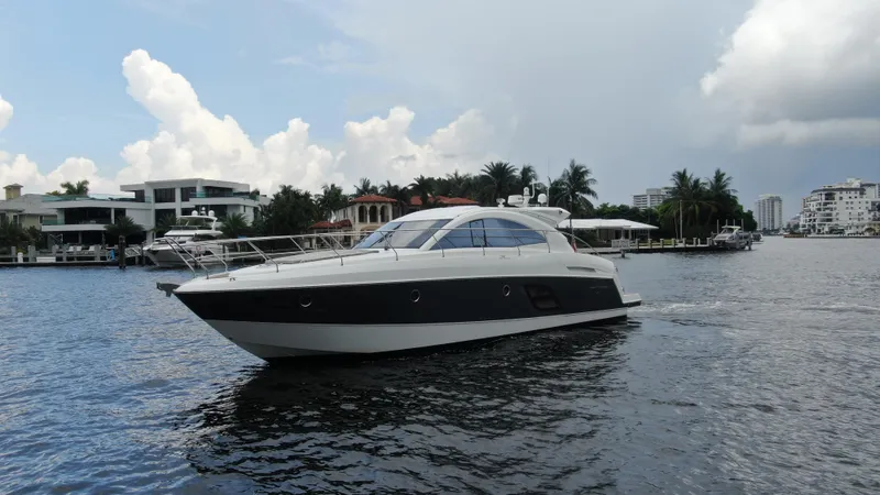 Oasis Yacht Photos Pics 2014 Beneteau GRAN TURISMO 49 yacht cruising on a scenic waterway.
