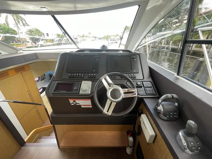 Oasis Yacht Photos Pics Helm of 2014 Beneteau Gran Turismo 49 yacht with modern controls and steering wheel.