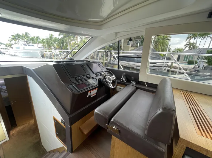 Oasis Yacht Photos Pics 2014 Beneteau Gran Turismo 49 yacht interior with modern helm and seating.