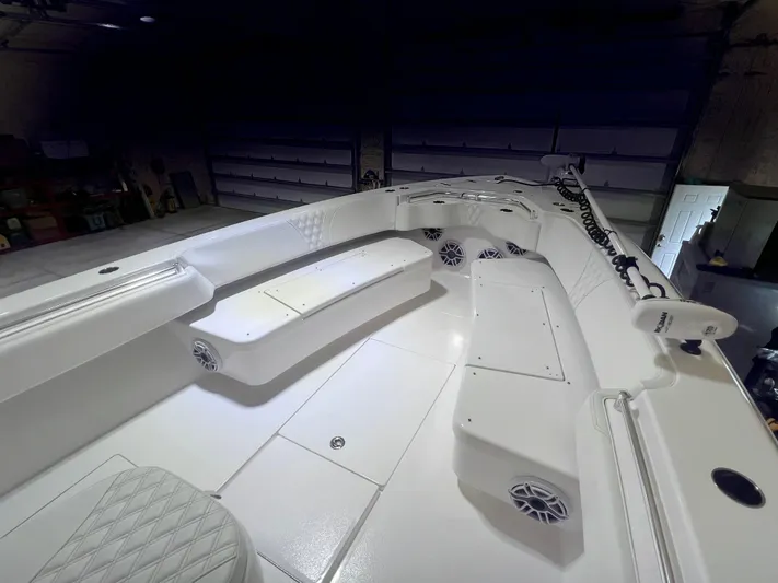  Yacht Photos Pics 2022 Contender 39 ST boat interior with white seating and storage compartments.