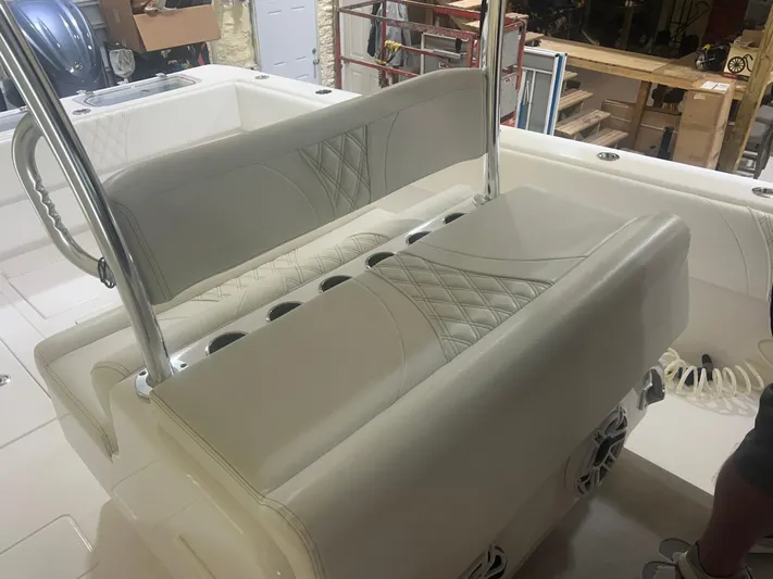  Yacht Photos Pics 2022 Contender 39 ST boat interior with cushioned seating and rod holders.