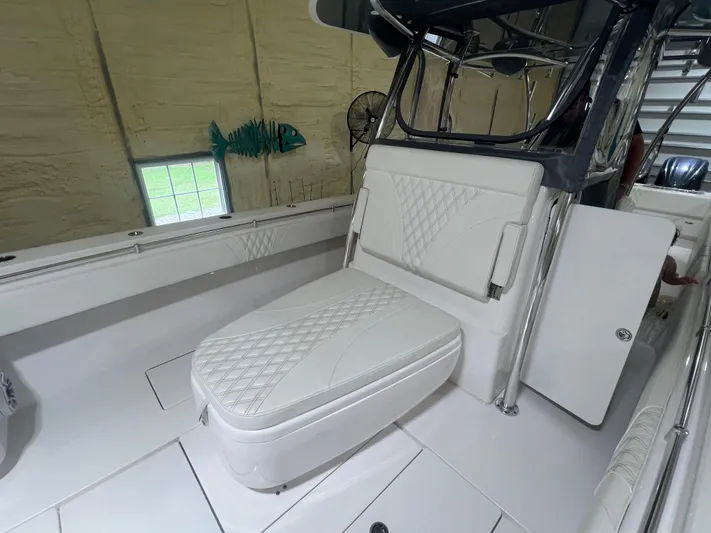  Yacht Photos Pics 2022 Contender 39 ST boat interior with white cushioned seating and modern design.