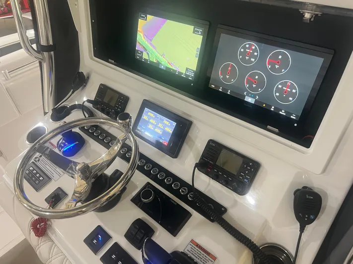  Yacht Photos Pics 2022 Contender 39 ST boat dashboard with advanced navigation and control systems.