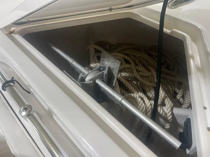  Yacht Photos Pics Storage compartment of 2022 Contender 39 ST boat with anchor and ropes.