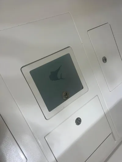  Yacht Photos Pics Contender 39 ST 2022 boat compartment with secure latches and sleek design.