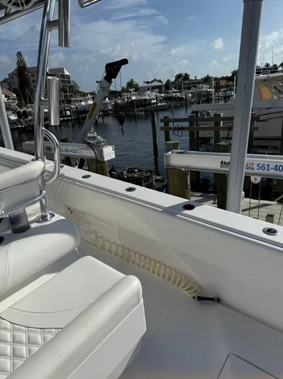  Yacht Photos Pics 2022 Contender 39 ST boat docked at marina under clear blue sky.