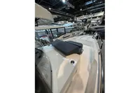 2022 Nimbus C8 boat displayed at an indoor exhibition with other boats.