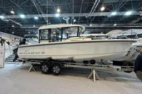 2022 Nimbus C8 boat displayed indoors on a trailer at a boat show.