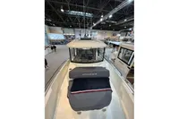 2022 Nimbus C8 boat showcased at an indoor exhibition, highlighting sleek design and modern features.