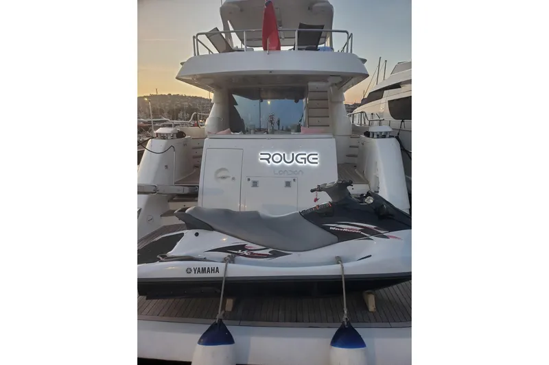  Yacht Photos Pics Luxury yacht Aicon 64 (2009) with Yamaha jet ski at sunset in marina.