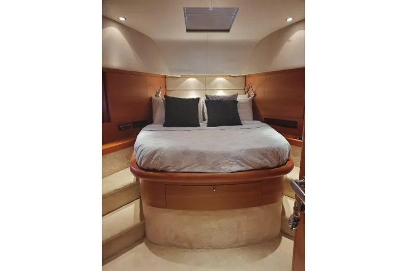  Yacht Photos Pics Luxurious bedroom interior of 2009 Aicon 64 yacht with cozy bedding and ambient lighting.