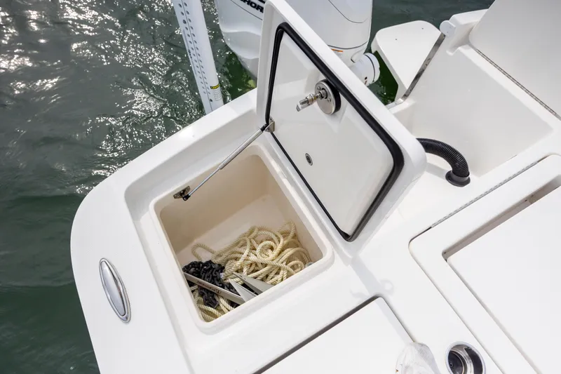  Yacht Photos Pics 2024 Regulator 26XO boat storage compartment with rope and anchor.