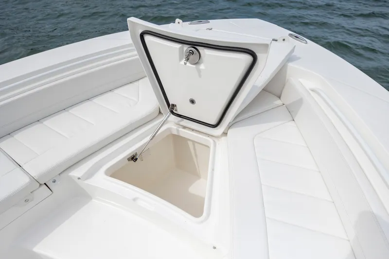  Yacht Photos Pics 2024 Regulator 26XO boat with open storage compartment on deck.
