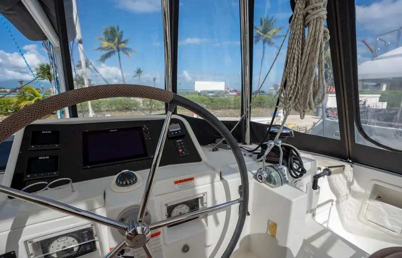  Yacht Photos Pics Helm of 2019 Lagoon 450 F catamaran with steering wheel and navigation instruments.