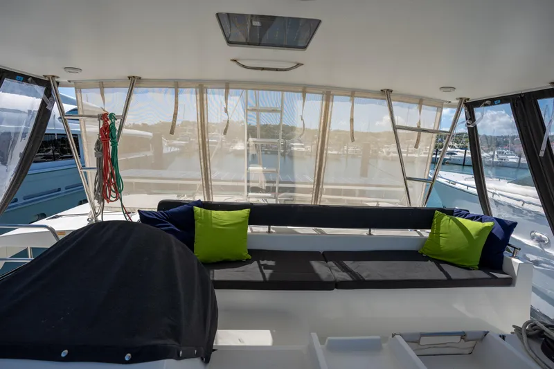  Yacht Photos Pics Interior view of 2019 Lagoon 450 F catamaran with seating and colorful cushions.