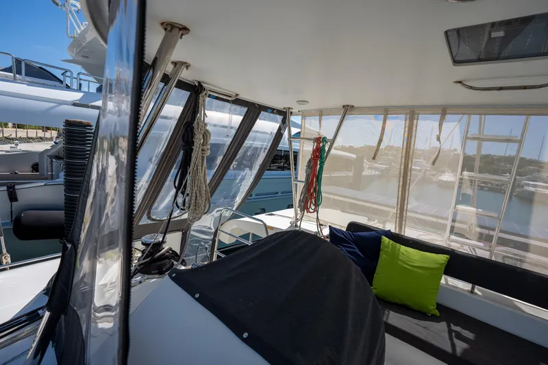  Yacht Photos Pics 2019 Lagoon 450 F catamaran interior with seating and colorful cushions.