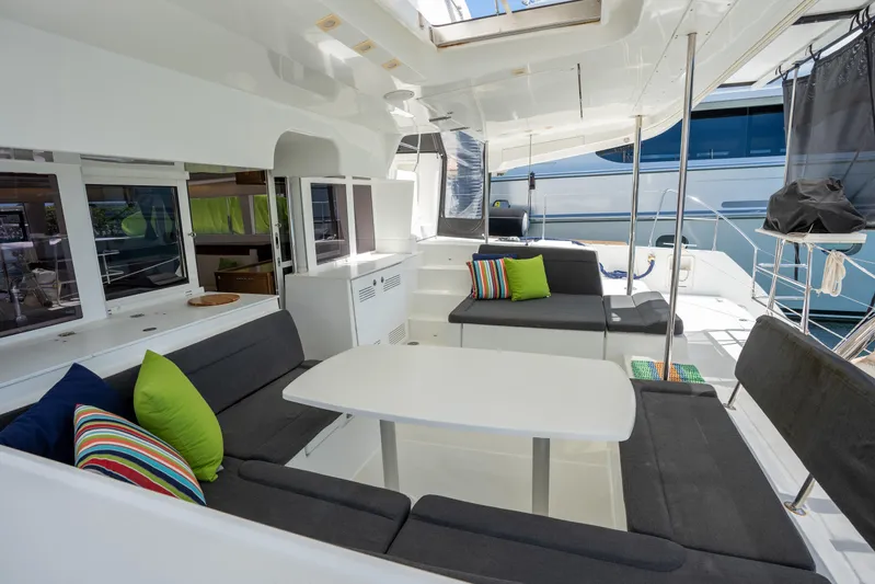  Yacht Photos Pics Spacious 2019 Lagoon 450 F yacht interior with modern seating and colorful cushions.